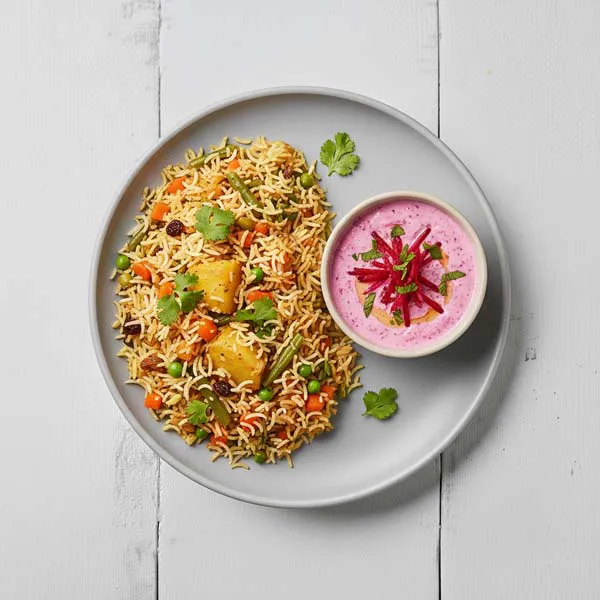 Delhi Style Vegetable Biryani with beetroot raita